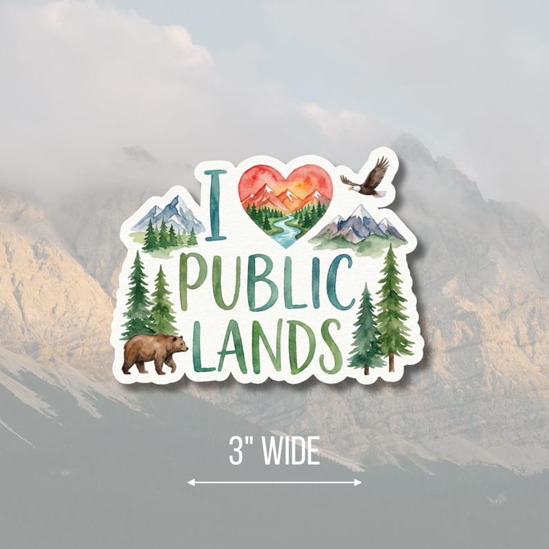 May include: A die-cut sticker with the text "I LOVE PUBLIC LANDS" in green and blue. The design includes a heart-shaped mountain scene, a bear, an eagle, and pine trees. The sticker is 3 inches wide.
