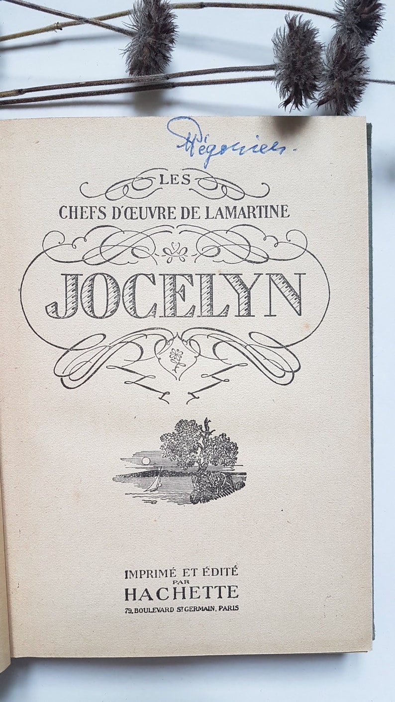 May include: A vintage book cover with the title "Jocelyn" in a decorative font. The book is part of a series called "Les Chefs d'&OElig;uvre de Lamartine" and was printed and published by Hachette in Paris.