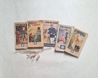 May include: Five vintage French books are displayed, each with a unique cover illustration. Titles include "Claire Davril", "Retour au Bercail", "Soie de Chine", "Deux Amours", and "La Blessure Cachée". Each book is priced at 1.50.