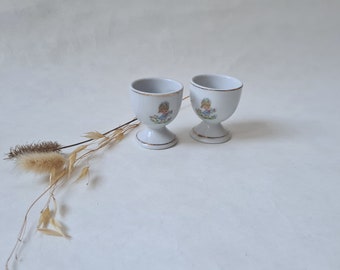 Vintage coquetiers lot 2/céramique porcelaine coloris blanc liseré doré/motif fillette chat fleurs/service art table oeuf/ancien rétro