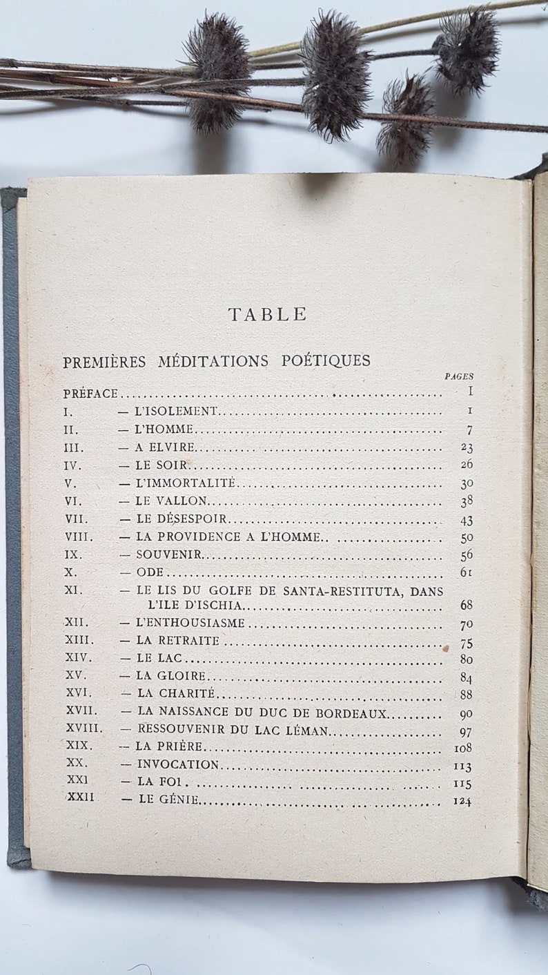 May include: A black and white book with the title "Table Premi&egrave;res M&eacute;ditations Po&eacute;tiques" and a table of contents listing the titles and page numbers of the poems.