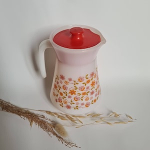 Vintage carafe pitcher/water drink/glass white/flower pattern/pink orange/red plastic cap spout/kitchen utensil/meal beverage/flea market