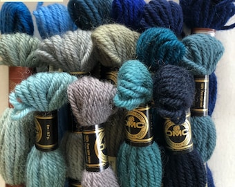 DMC tapestry wool bundles and background wool hanks