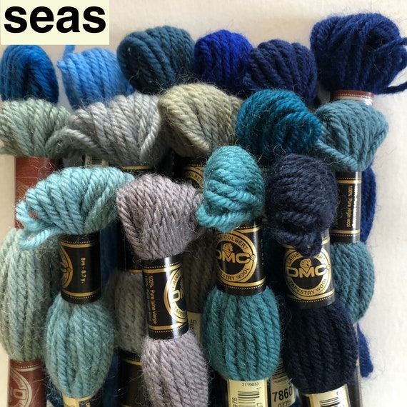 DMC tapestry wool bundles and background wool hanks