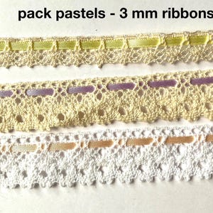 May include: Three strips of 3 mm ribbons woven through cream and white lace trim. The top ribbon is light green, the middle is lavender, and the bottom is peach. The text pack pastels - 3 mm ribbons is centered above the lace trim strips.