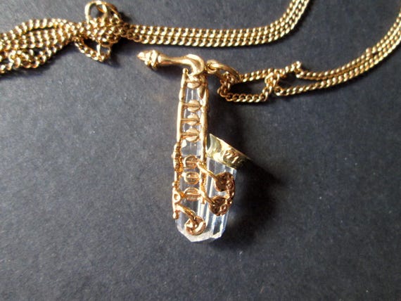 Wonderful Vintage Pendant Necklace Swarovski Swan Mark Figural Clear Faceted Crystal Saxophone Musical Instrument Shiny Gold Tone Signed View 2