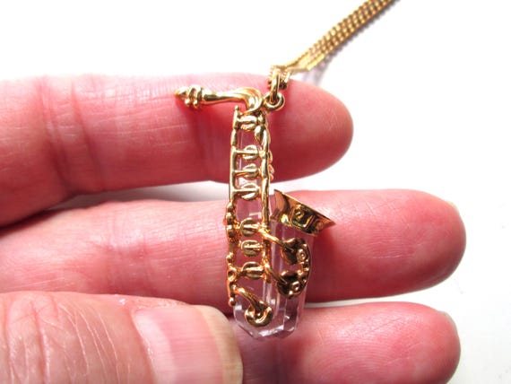 Wonderful Vintage Pendant Necklace Swarovski Swan Mark Figural Clear Faceted Crystal Saxophone Musical Instrument Shiny Gold Tone Signed View 5