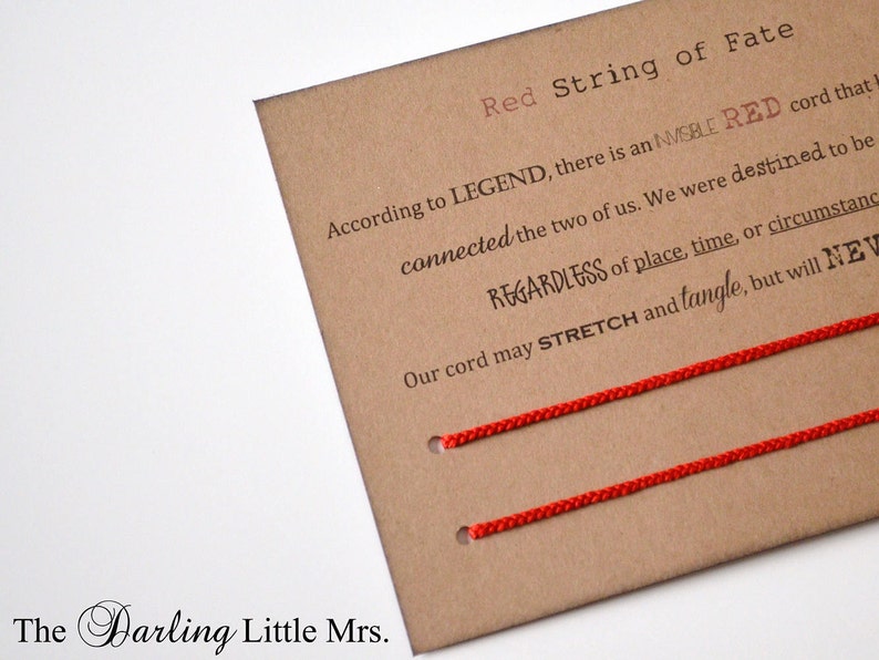 May include: Red string of fate card with the text "According to LEGEND, there is an INVISIBLE RED cord that connected the two of us. We were destined to be REGARDLESS of place, time, or circumstance. Our cord may STRETCH and tangle, but will NEVER break."