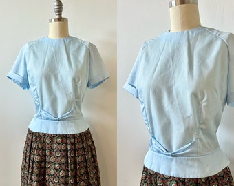 1960s AS-IS Jami Originals Pastel Crepe Blouse | 60s Light Blue Button Back Shirt | Vintage Short Sleeve Peplum Top | Size S