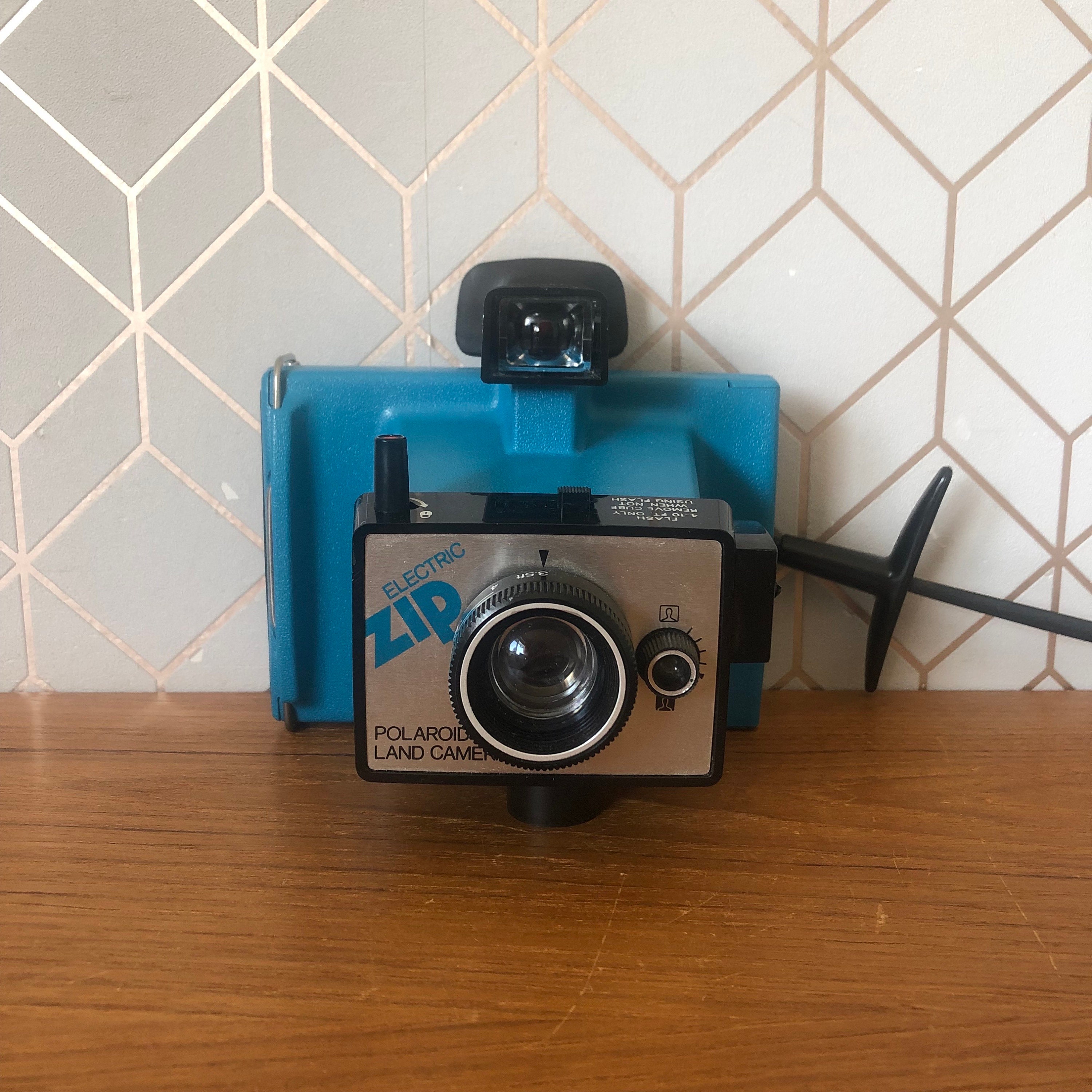 70's Retro Electric Zip Polaroid, Land Camera With Black Wrist Strap, Rubber Eye Guard, for Flash Cubes, Collectable Polaroid, Made in USA - Etsy 70's Retro Electric Zip Polaroid, Land Camera With Black Wrist Strap, Rubber Eye Guard, for Flash Cubes, Collectable Polaroid, Made in USA - Etsy