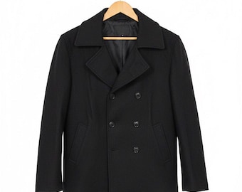 May include: A black double-breasted pea coat hanging on a wooden hanger. The coat has a notched collar, two rows of buttons, and two front pockets. The coat is made of a dark, possibly wool, material.