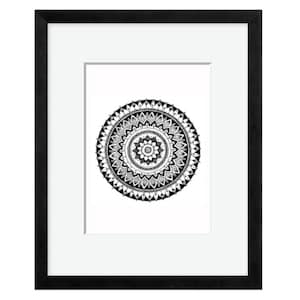 May include: A black and white mandala design framed in a black frame. The mandala is intricate and detailed, with a circular pattern of geometric shapes and floral motifs.