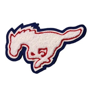 May include: A white, running horse patch with red and blue accents. The horse is outlined in red thread, with a blue border and a white, textured body. The number "5" is visible on the horse's body.