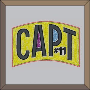 May include: Yellow embroidered patch with black text that reads "CAPT #11".