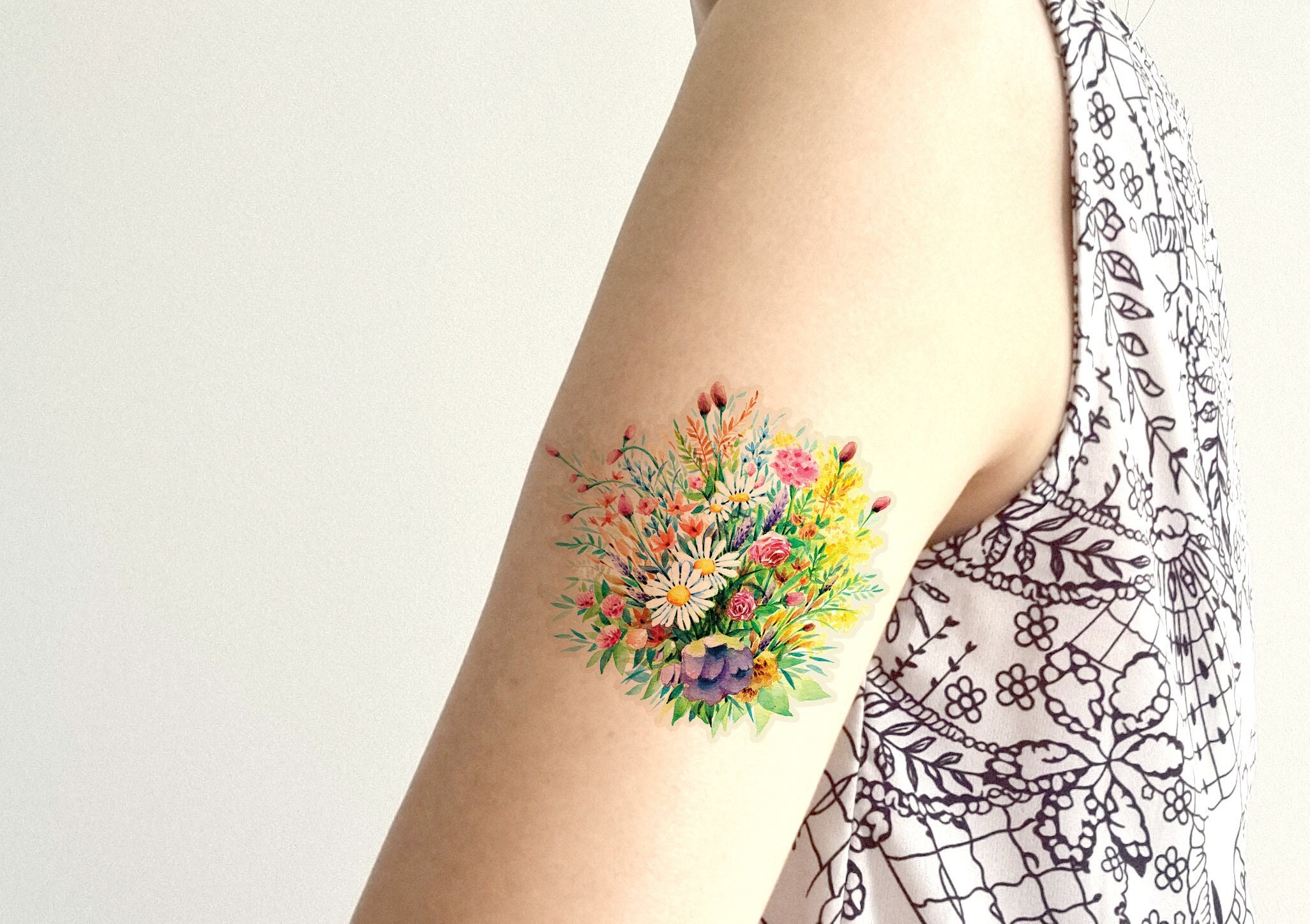 Wildflower tattoo on the neck  Tattoogridnet