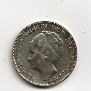 May include: A silver 1930 Netherlands 1 Gulden coin, 10g, .720 silver, in a protective sleeve. The coin features a profile of a woman and the text "KONINGIN WILHELMINA DER NEDERLANDEN". A handwritten note indicates the coin's details.
