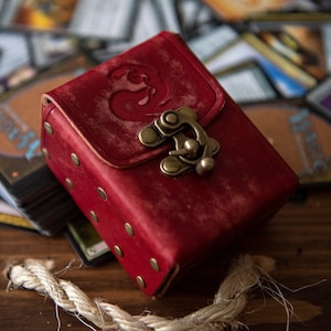 May include: A set of three ceramic mugs with a speckled, matte finish. The mugs are in shades of cream, light gray, and dark gray. Each mug has a simple, minimalist design, perfect for coffee or tea.