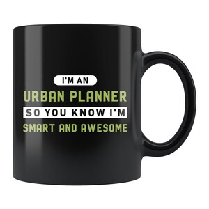 May include: Black ceramic mug with the text "I'M AN URBAN PLANNER SO YOU KNOW I'M SMART AND AWESOME" in white and green. The mug has a large handle and a glossy finish. A perfect gift for urban planners.