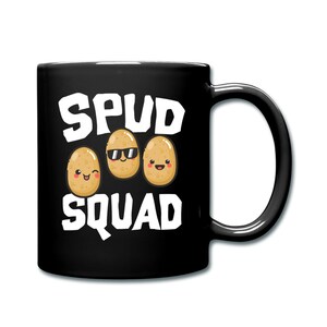 May include: Black coffee mug with white text that reads "Spud Squad" and three cartoon potatoes with faces. The potato in the middle is wearing sunglasses.