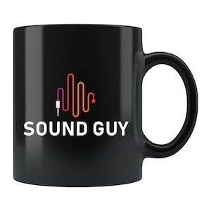 May include: Black ceramic mug with a white logo that says "SOUND GUY" and a stylized graphic of a sound wave with a red and orange audio cable.