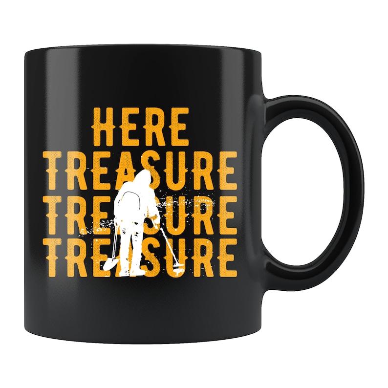 May include: Black ceramic coffee mug with a white silhouette of a person holding a metal detector. The text "HERE TREASURE TREASURE TREASURE" is printed in yellow on the mug.