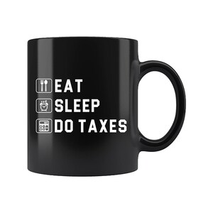 May include: Black coffee mug with white text that reads "Eat Sleep Do Taxes". The text is in a checklist format with icons for eating, sleeping, and a calculator.