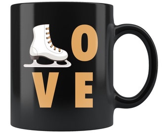 May include: Black coffee mug with a white figure skate and the word "LOVE" in orange letters.