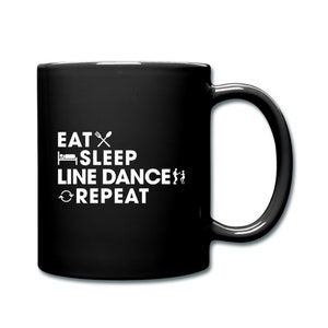 May include: Black coffee mug with white text that reads "Eat, Sleep, Line Dance, Repeat" with icons for eating, sleeping, and line dancing.