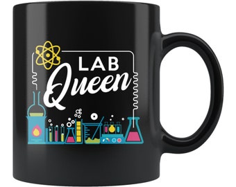 May include: Black ceramic mug with a white design of a lab with beakers, flasks, and other equipment. The text "LAB Queen" is written in a stylized font.