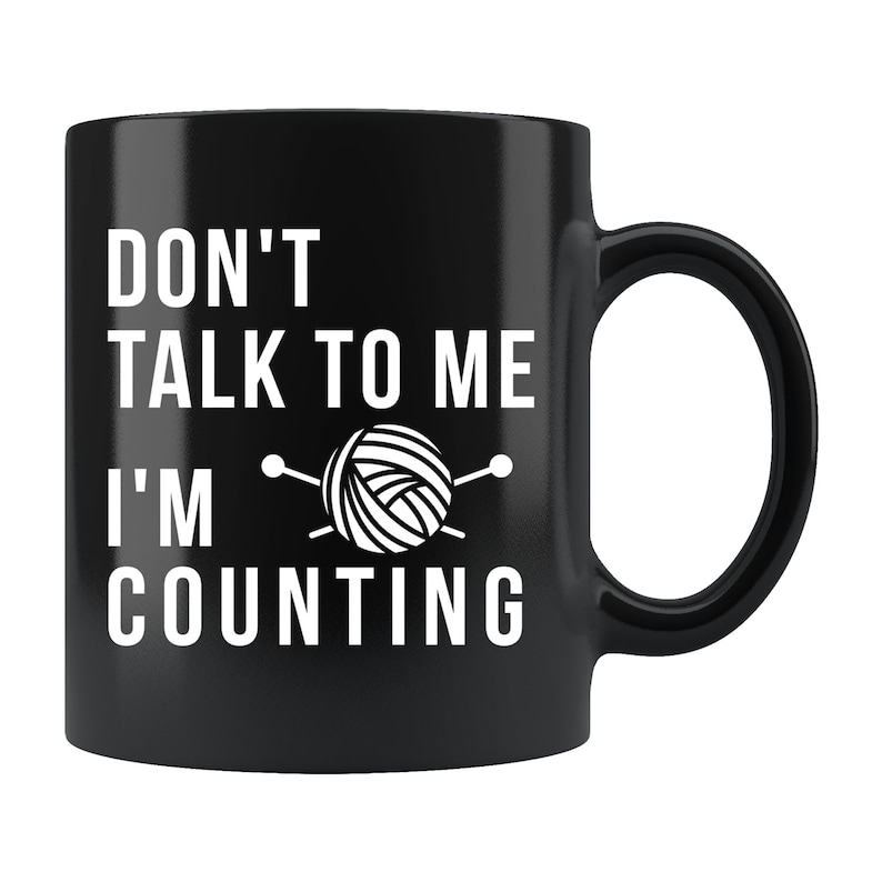 May include: Black ceramic mug with white text that reads "Don't talk to me I'm counting" with a yarn ball and knitting needles graphic.
