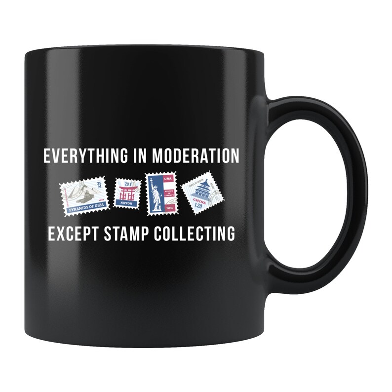 May include: Black coffee mug with white text that reads "Everything in moderation except stamp collecting". The mug has five colorful postage stamps with images of the Pyramids of Giza, Japan, the Statue of Liberty, and the Forbidden City.