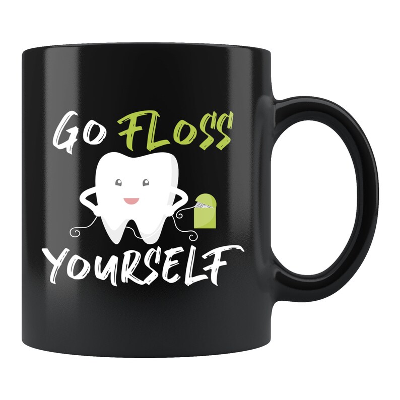 May include: Black coffee mug with a white cartoon tooth flossing. The text "Go Floss Yourself" is written in white.