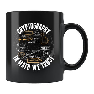 May include: Black ceramic coffee mug with a white graphic design of geometric shapes and mathematical formulas. The text "CRYPTOGRAPHY IN MATH WE TRUST" is printed in white on the mug.