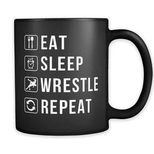 May include: Black coffee mug with white text that reads "Eat Sleep Wrestle Repeat".