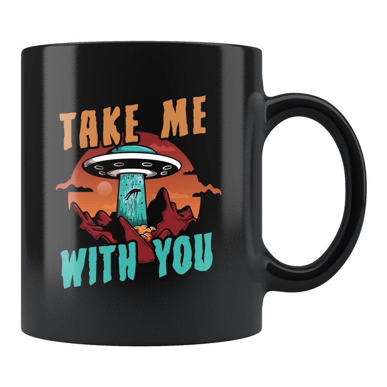 May include: Black coffee mug with a graphic of a UFO and the text "Take me with you".