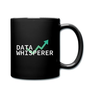 May include: Black coffee mug with white text that reads "DATA WHISPERER" and a green upward arrow graphic.