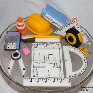 May include: A set of fondant cake toppers for a civil engineering themed cake. The set includes a yellow hard hat, a calculator, a compass, a ruler, a pencil, a protractor, a tape measure, a blueprint, and a traffic cone.