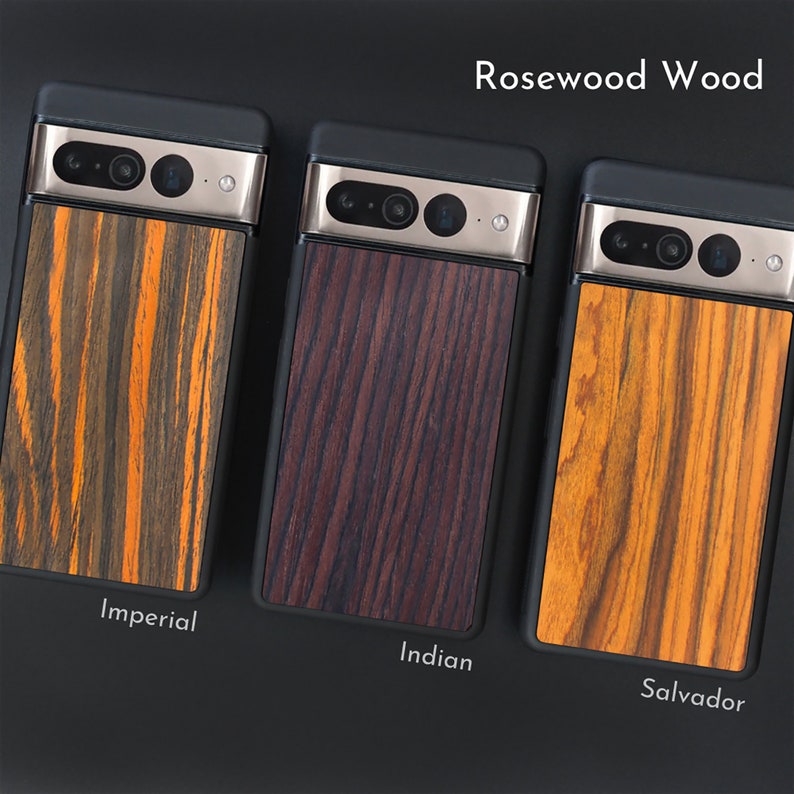May include: Three phone cases with rosewood wood backs. The cases have black frames and silver camera housings. The wood grains are labeled "Imperial", "Indian", and "Salvador", with colors ranging from orange and brown to deep reddish-brown.