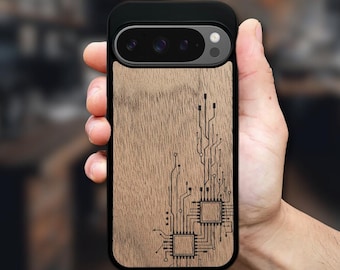 May include: A black smartphone case featuring a light brown wood grain back panel. The wood surface is engraved with a dark, intricate circuit board pattern, including two square microchip designs connected by thin lines that extend upward.
