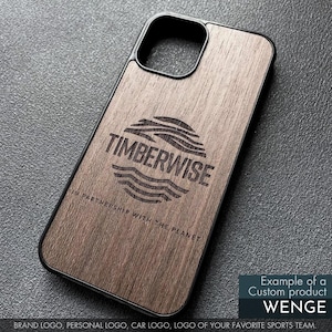 May include: A wooden phone case with a black border. The case features the Timberwise logo and the text "IN PARTNERSHIP WITH THE PLANET." The case is an example of a custom product, Wenge, and can feature a brand logo, personal logo, car logo, or sports team logo.