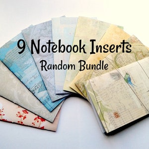 May include: A bundle of nine notebook inserts arranged in a fan shape, featuring various printed designs including maps, musical notes, floral patterns, and birds. The text 9 Notebook Inserts Random Bundle is printed in black across the centre of the collection.