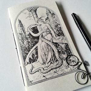 May include: A black and white illustration of a woman with long hair, wearing a flowing robe, standing in a garden with a snake wrapped around her. The illustration is framed in a black border.