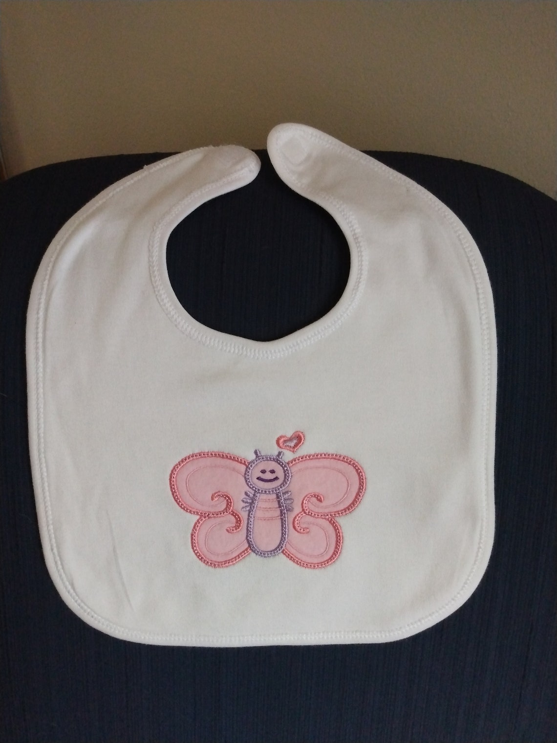 Baby bib white with pink butterfly embroidered on it very  etsy