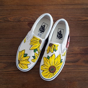 white slip on vans with sunflowers