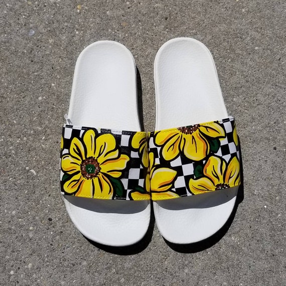 white nike sandals with sunflowers