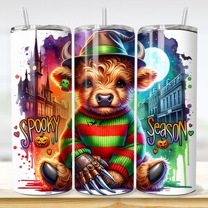 May include: A Halloween-themed tumbler featuring a cartoon Highland cow wearing a witch hat and a striped sweater. The tumbler has the words "Spooky Season" and a spooky background with a castle, moon, and bats.