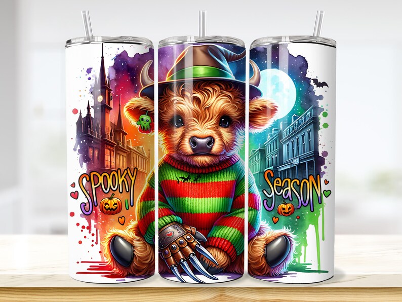 May include: A Halloween-themed tumbler featuring a cartoon Highland cow wearing a witch hat and a striped sweater. The tumbler has the words "Spooky Season" and a spooky background with a castle, moon, and bats.