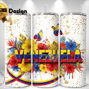May include: A white tumbler with a design featuring the word "VENEZUELA" in red, yellow, and blue, surrounded by colorful flowers, butterflies, and gold confetti. The design includes the Venezuelan flag colors.