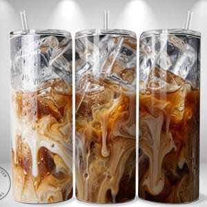 May include: Three clear tumblers filled with iced coffee, ice cubes, and a straw. The coffee has a creamy, swirled appearance with a mix of light and dark brown hues. The tumblers have a condensation effect, with water droplets visible.