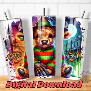 May include: Three white stainless steel tumblers with Halloween-themed designs. Each tumbler features a cartoon bear dressed as Freddy Krueger, with the words "Spooky" and "Season" in colorful text. The tumblers have a straw.